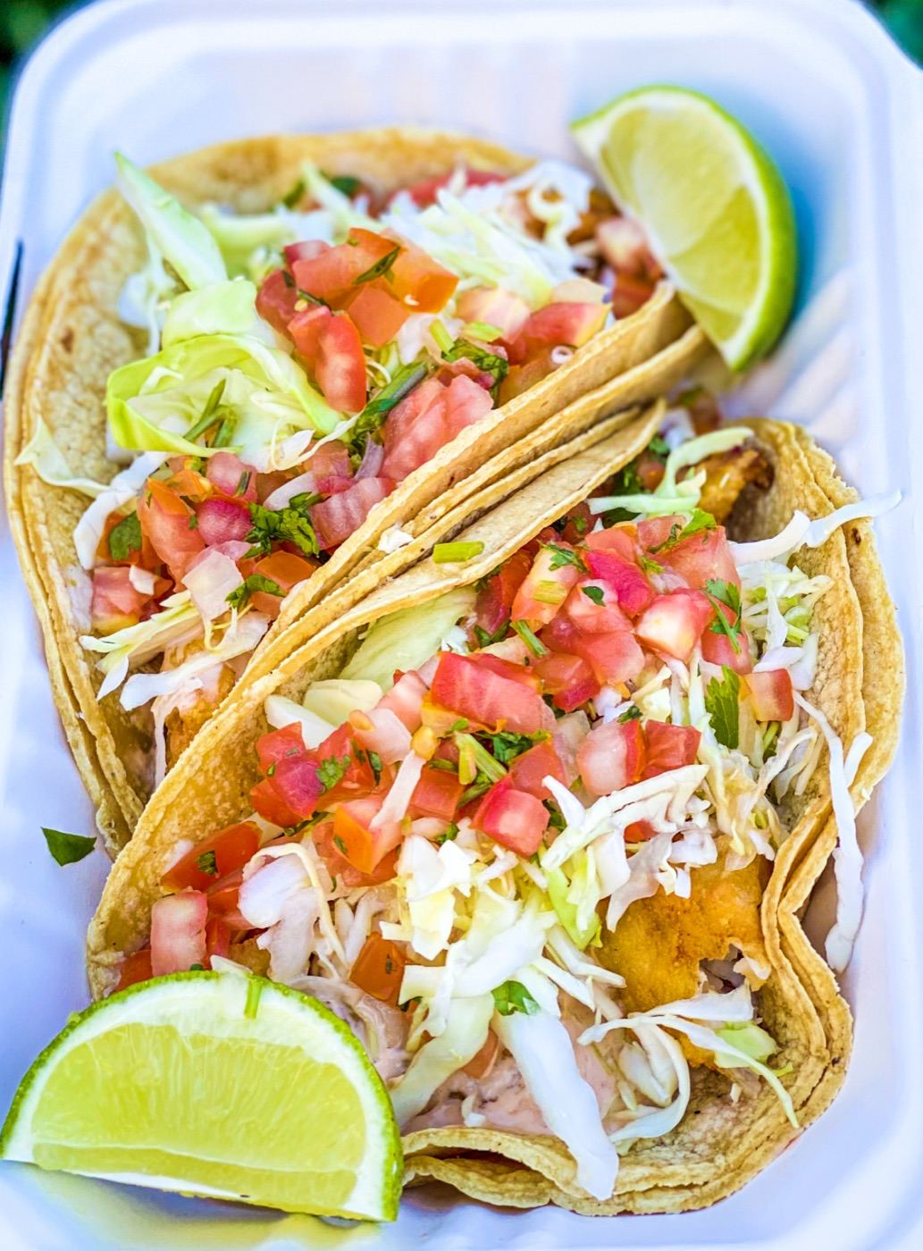 El Pueblo battered fish taco with cabbage, pico de gallo, and a wedge of lime